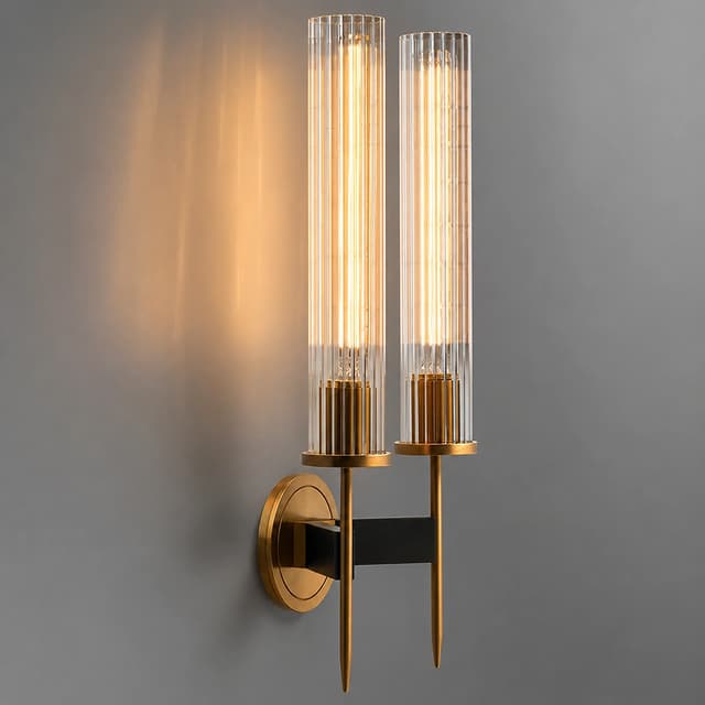 Two light clear fluted glass wall sconce with copper frame and warm glow
