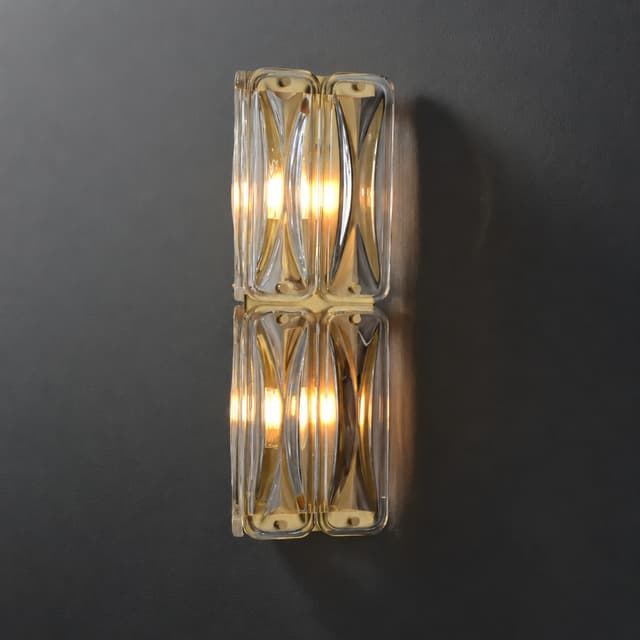 Double tier geometric clear glass wall sconce with warm brass accents