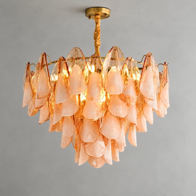 Illuminated peach toned glass petal chandelier with a warm decorative glow