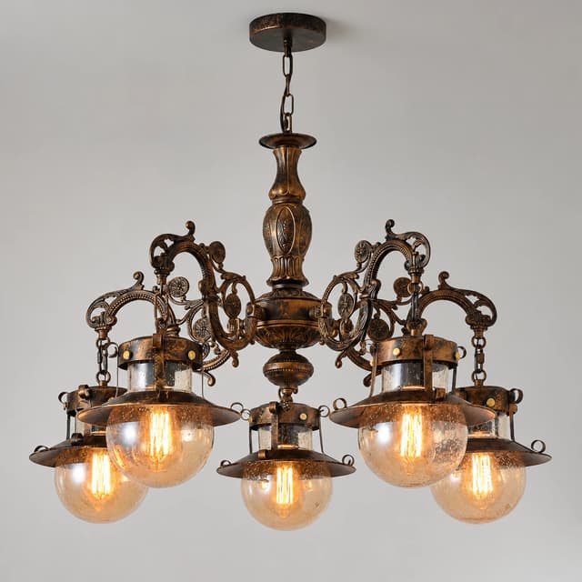 Front view of a vintage bronze five light chandelier with ornate scrollwork and translucent seeded glass globes