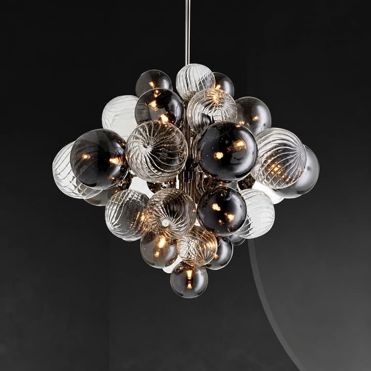 Close up of sculptural glass globe cluster chandelier with smoked, clear and spiral ribbed glass spheres