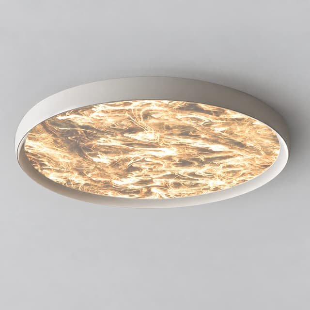 Modern white round flush mount ceiling light with a luminous marble effect diffuser and soft warm glow