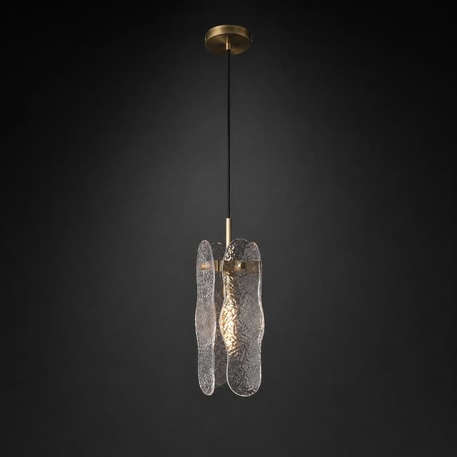 Small textured glass pendant light beside a bed with warm diffused illumination