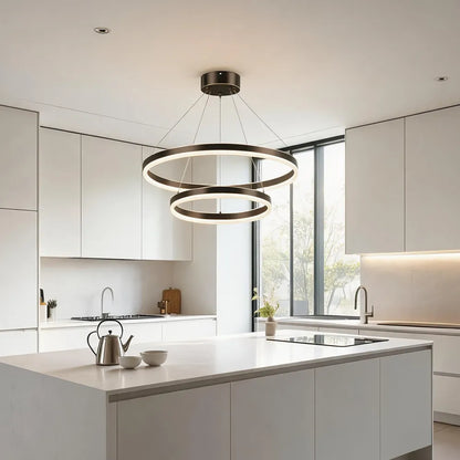 Double ring LED chandelier over white kitchen island in modern kitchen