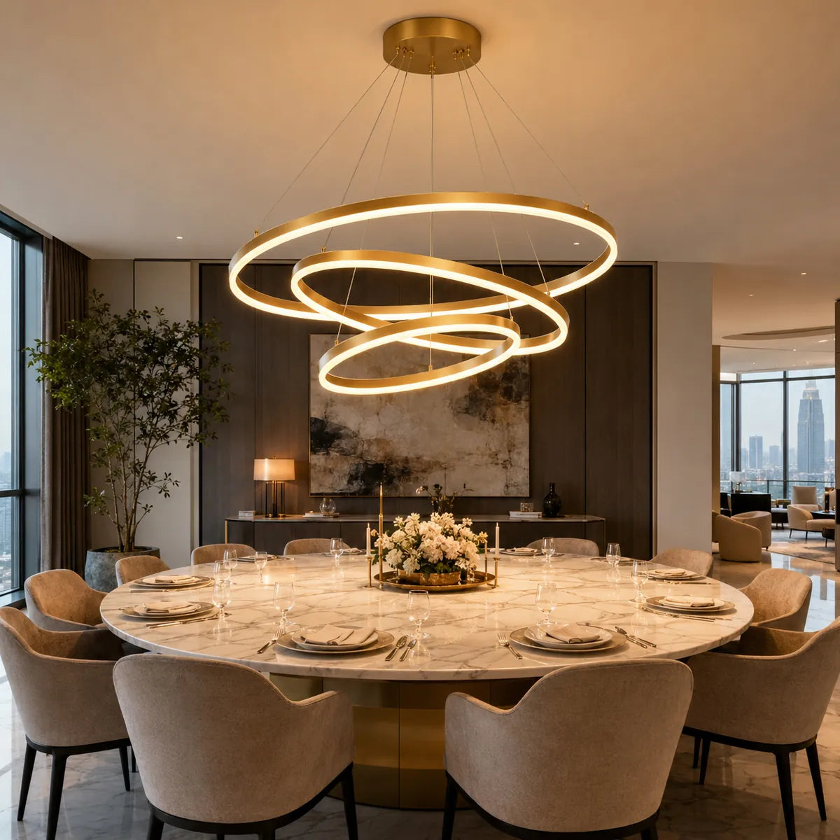 Modern gold LED ring chandelier glowing above a round dining table in a warm apartment dining room