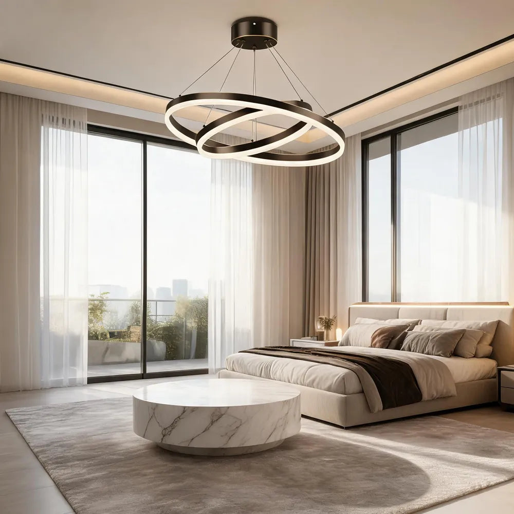 Blackened copper double ring LED chandelier in modern bedroom with large windows