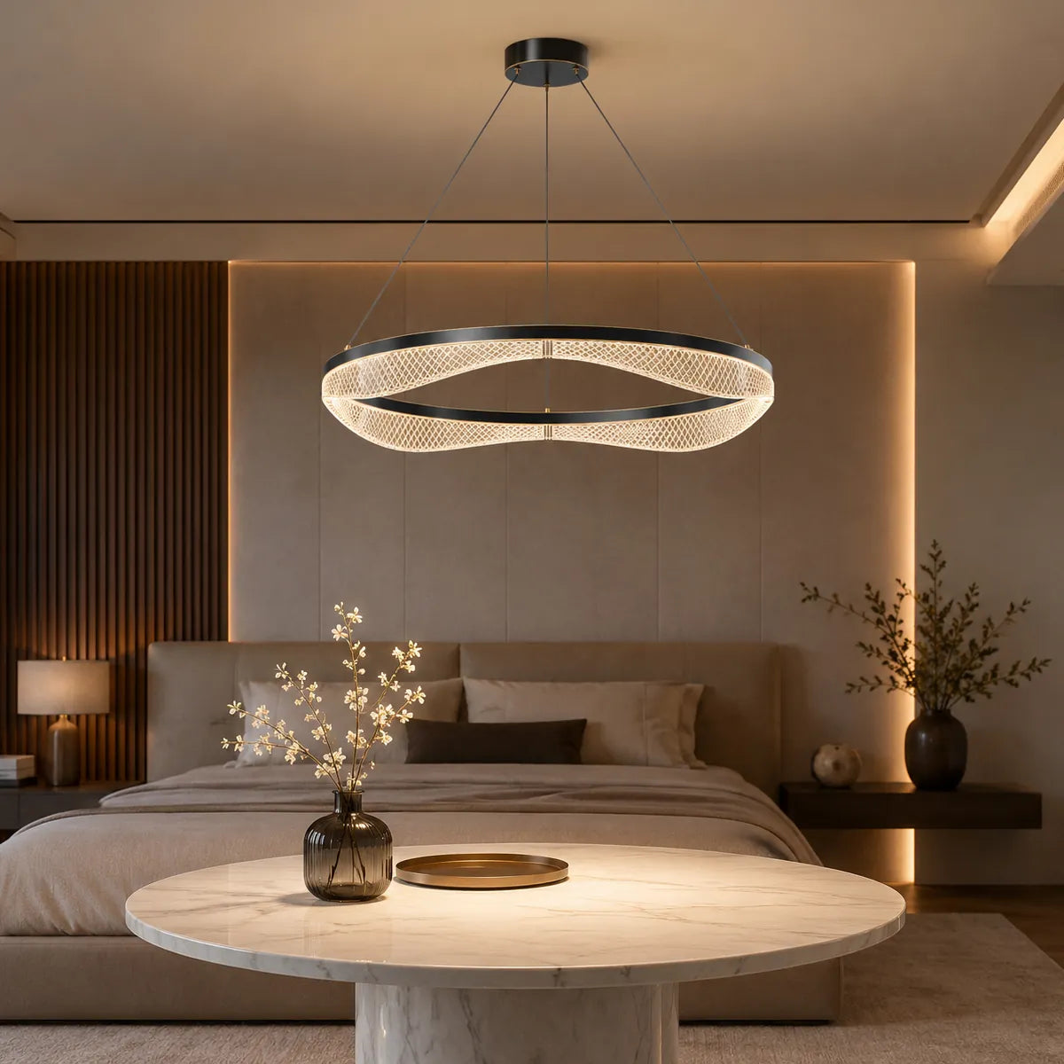 Acrylic LED chandelier above bedroom sitting table with warm glow