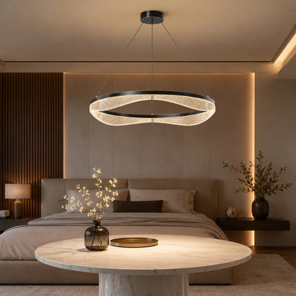 Acrylic LED chandelier above bedroom sitting table with warm glow