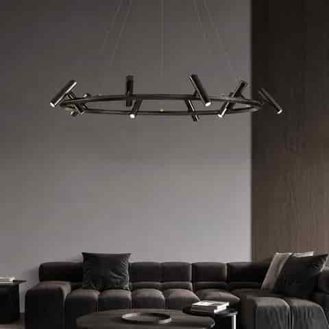 Black ring spotlight chandelier installed in a modern living room with directional lighting and minimalist metal design