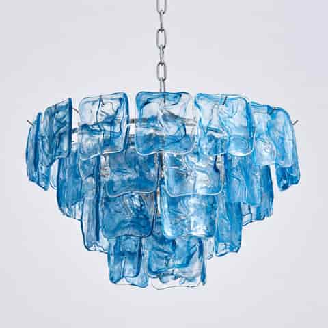 Compact blue glass chandelier with layered decorative panels and a metal hanging chain