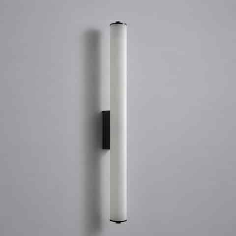 Unlit long vertical wall sconce with white cylindrical diffuser and black metal finish