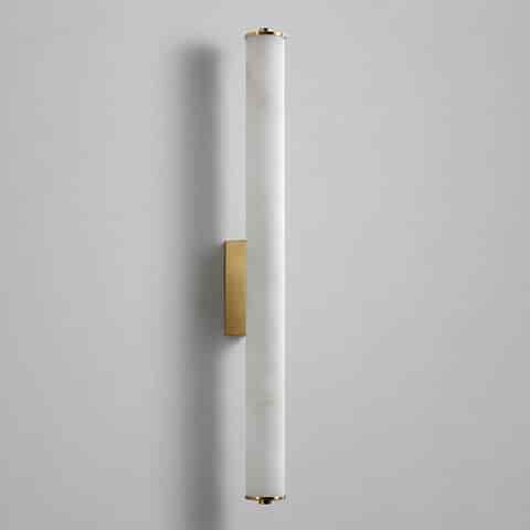 Unlit vertical cylinder wall sconce with white stone look diffuser and brass finish