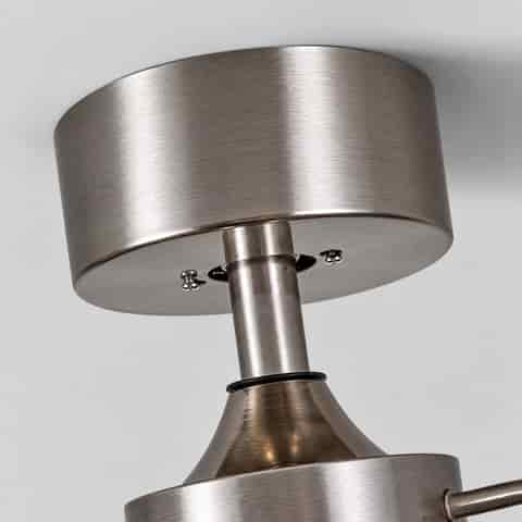 Close up of the sand nickel ceiling canopy and metal mounting structure on a modern ceiling fan