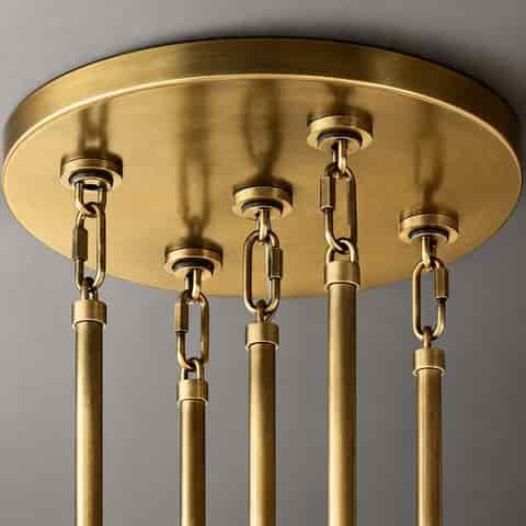 Detail of the downrod on a crystal chandelier featuring a copper plated finish; the metal component has a copper plated surface treatment