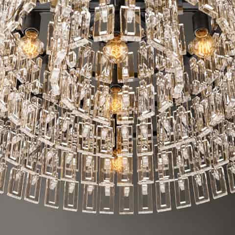 Black finish modern drum chandelier featuring multiple concentric rings and hanging clear decorative elements