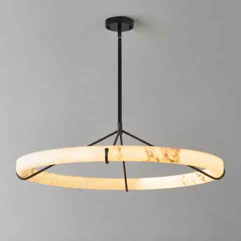 Close up of faux alabaster ring chandelier with warm metal inner frame