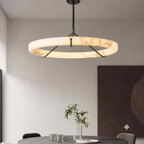 Faux alabaster ring chandelier above a modern round dining table