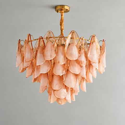 Full view of a peach pink Murano glass petal chandelier with a gold tone metal canopy
