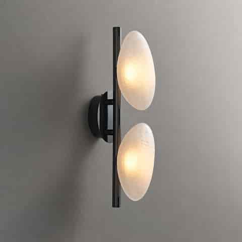 Two light frosted organic glass wall sconce with black vertical frame and soft diffused glow