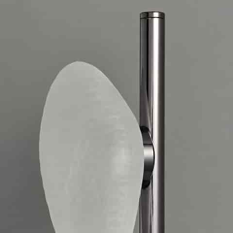 Close up of frosted textured glass shade and polished black metal frame on modern wall light