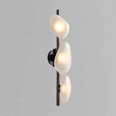 Three light wall sconce with frosted white organic glass shades and vertical black metal frame