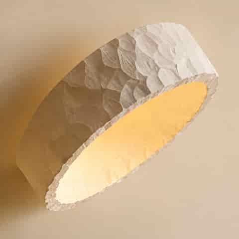 Detailed view of the organic textured resin shade and translucent acrylic diffuser of a modern flush mount ceiling light