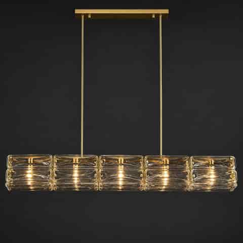 Front view of gold copper linear chandelier with symmetrical textured glass blocks and twin suspension rods