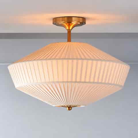 French Art Deco drum flush mount ceiling light with layered ivory pleated fabric shade and warm copper finish metal frame