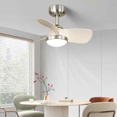 Sand nickel ceiling fan with light and ivory acrylic blades in a modern dining room