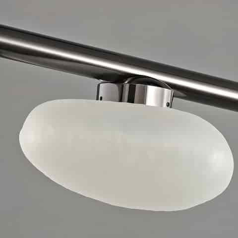 Close up details of clear textured and frosted organic glass shades with dark metal linear chandelier frame