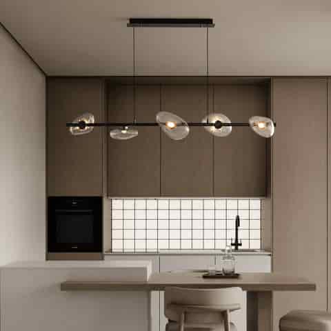 Modern six light linear chandelier with clear textured organic glass shades above a wood dining table in a contemporary kitchen