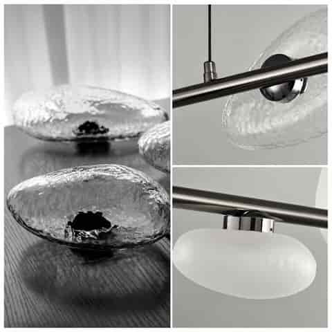 Close up of clear textured glass shade and polished dark metal frame on modern linear chandelier