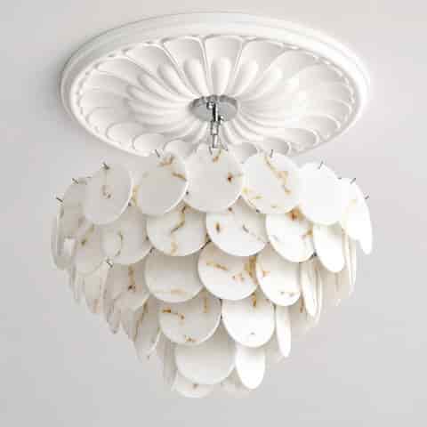 White faux alabaster disc chandelier with polished metal chain and tiered cascading design shown unlit
