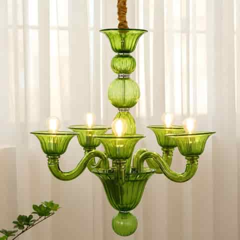 Green glass statement chandelier in a bright vintage inspired interior