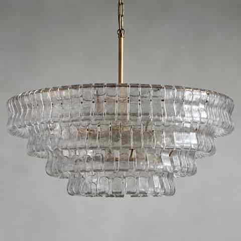 Tiered glass chandelier with textured clear glass panels and dark metal chain, modern pendant lighting