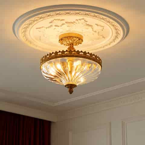 French Rococo antique gold glass semi flush mount ceiling light installed beneath an ornate decorative ceiling