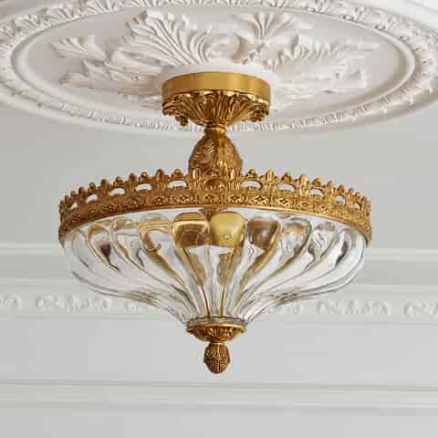 French Rococo gold glass semi flush ceiling light with a ribbed clear glass bowl and elaborate decorative copper frame