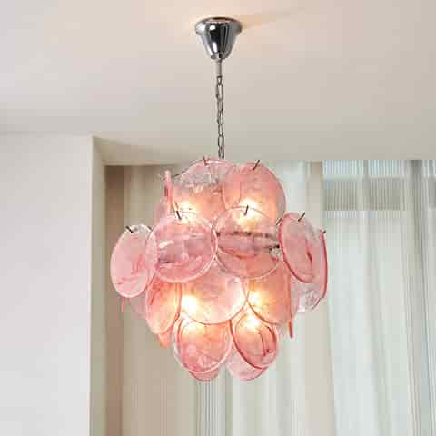 Pink Murano glass chandelier installed beneath an ornate decorative ceiling medallion in an elegant interior