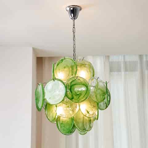 Green Murano glass chandelier with translucent swirling glass discs and warm illuminated bulbs