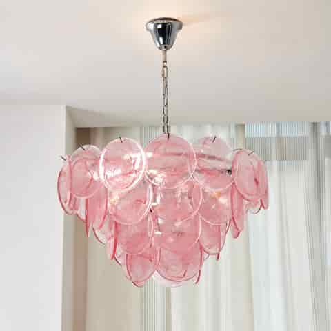 Pink Murano glass chandelier with layered translucent glass discs and warm lighting in a modern living space