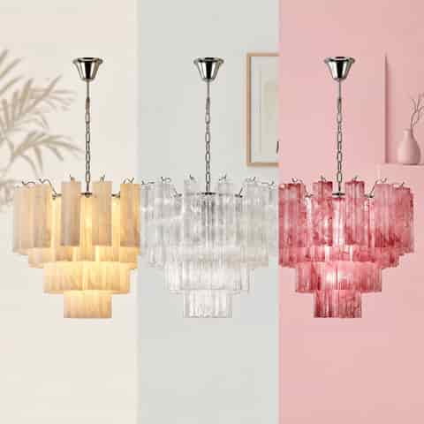 Three color variations of a tiered glass chandelier, shown in warm ivory, clear glass, and pink finishes