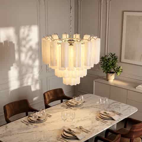 Textured glass chandelier illuminating a dining room with a marble table and contemporary wall paneling