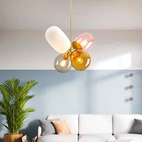 Modern colorful glass pendant chandelier with four clustered shades in a bright contemporary living room