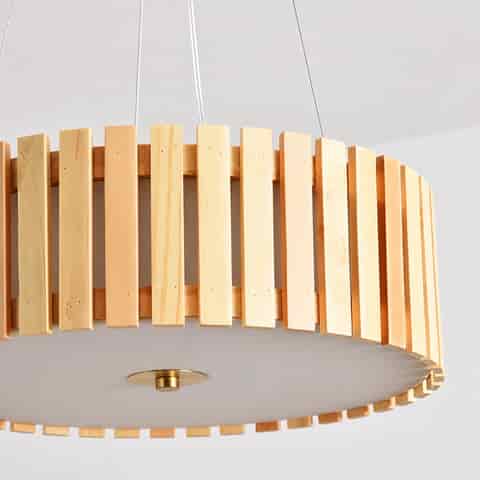 Close up of vertical natural wood slats on a modern round drum pendant light