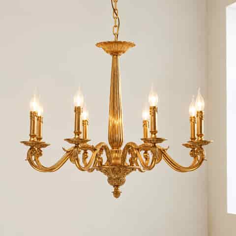 Ornate gold chandelier with multiple candle style lights, curved arms and detailed European classical ornamentation