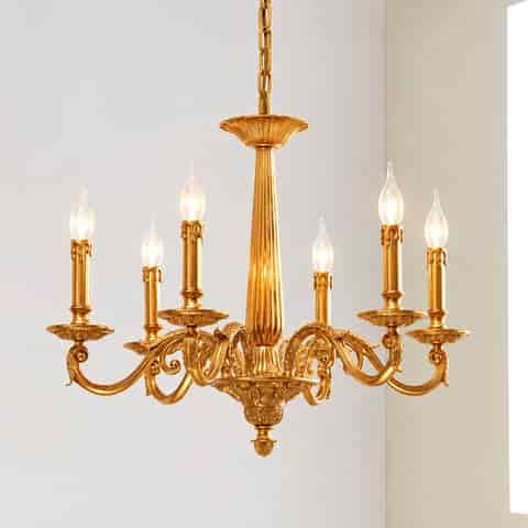 Front view of an ornate gold chandelier with symmetrical candle style lights and European traditional detailing