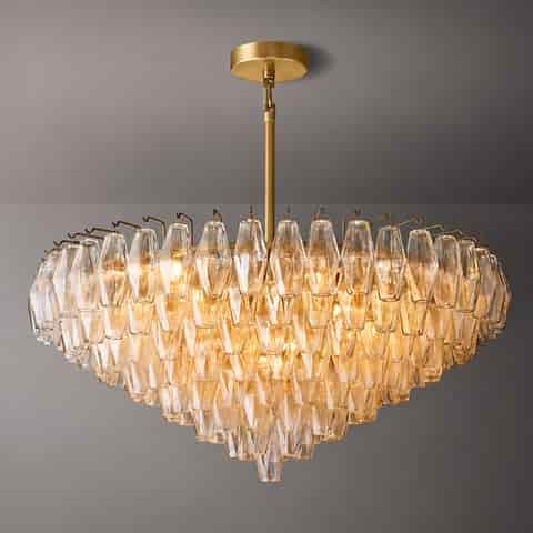 Illuminated tiered amber glass waterfall chandelier with gold tone canopy and cascading