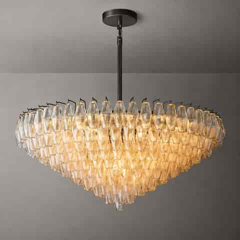 Illuminated amber glass waterfall chandelier with dark ceiling canopy and multilayer cascading