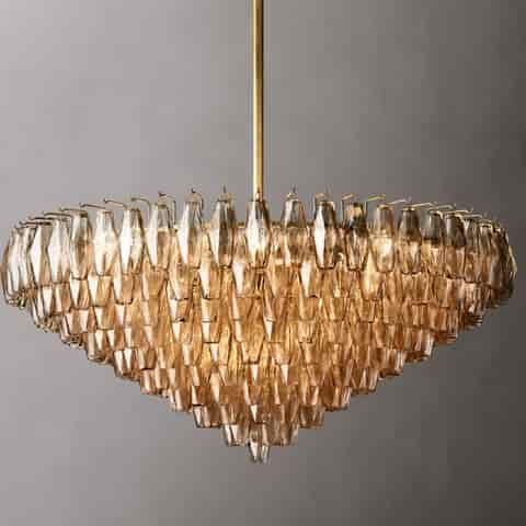 Front view of amber textured glass chandelier with layered waterfall tiers and slim gold tone