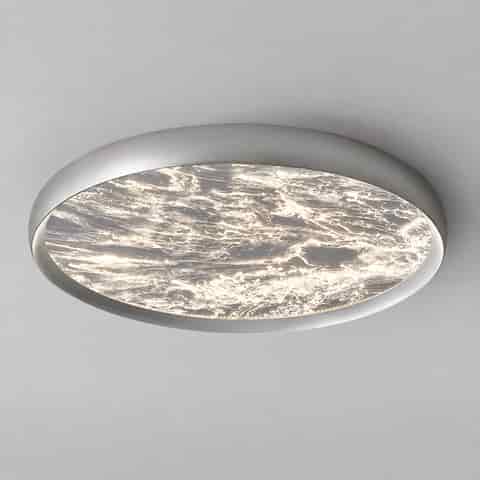 White round flush mount ceiling light with a translucent marble effect diffuser and soft ambient illumination